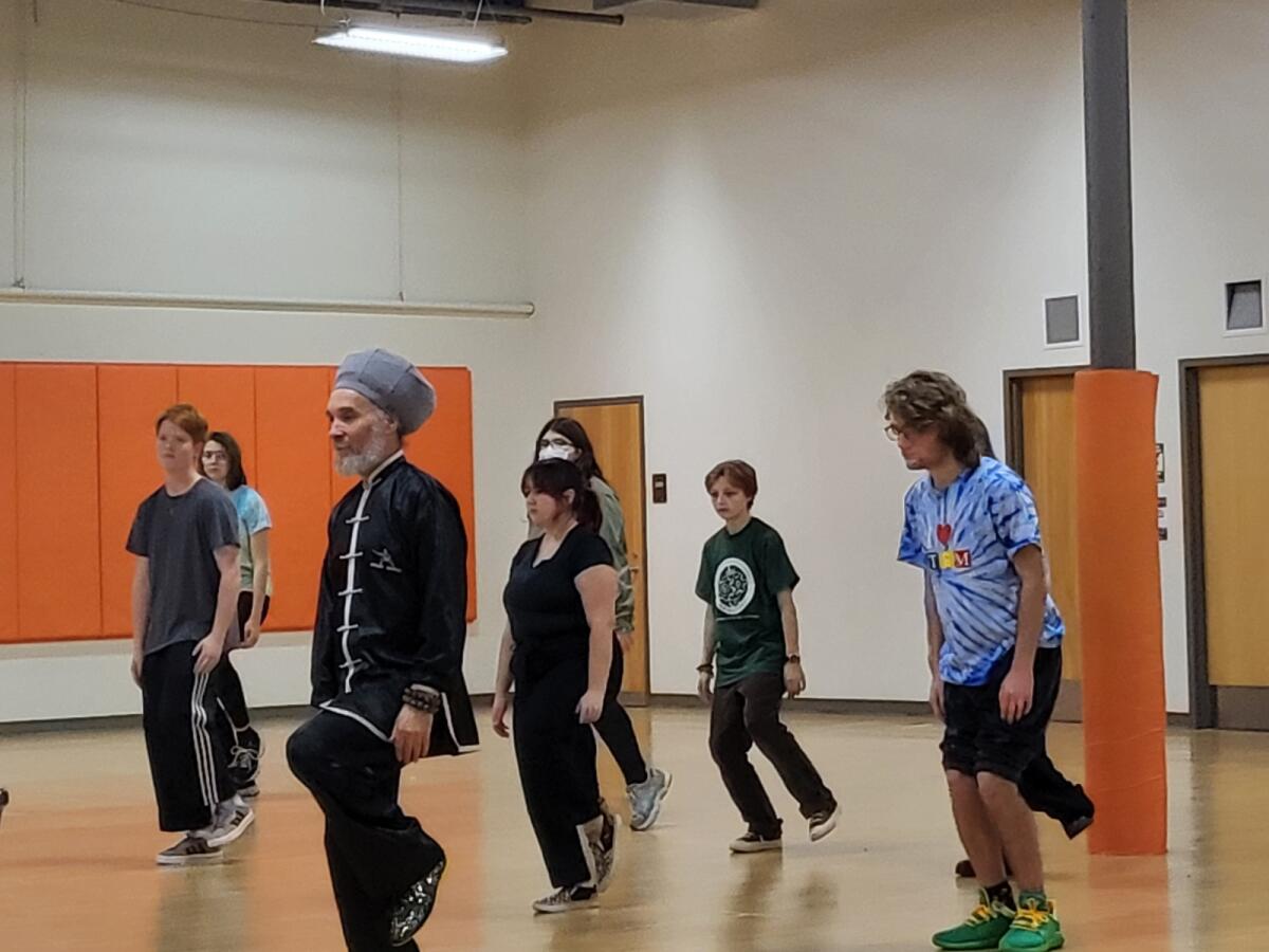 Rio doing tai-chi with other kids.